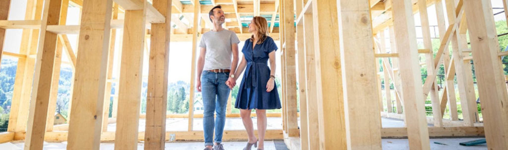 man and woman in new home construction